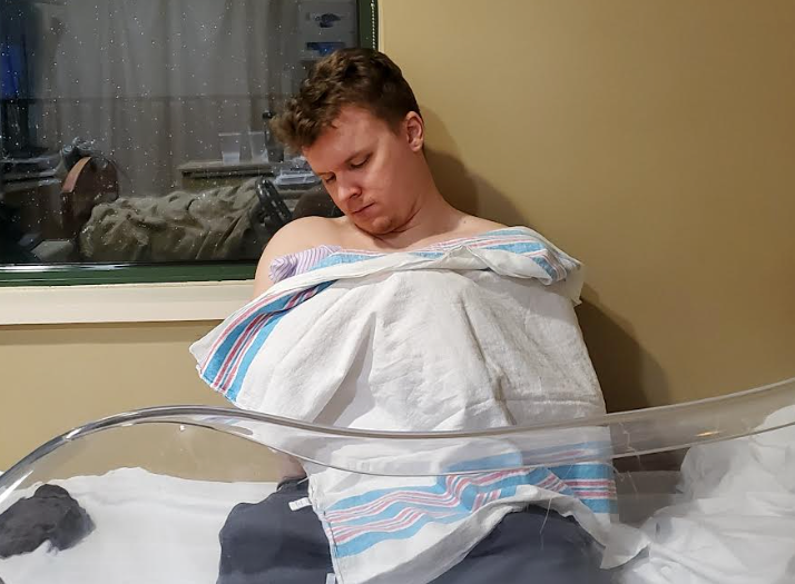 The writer's husband doing skin-to-skin contact with their youngest son in a Marietta, Georgia, hospital.