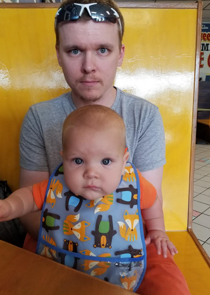 The writer's husband and their oldest son sit in an ice cream parlor in Gainesville, Florida.