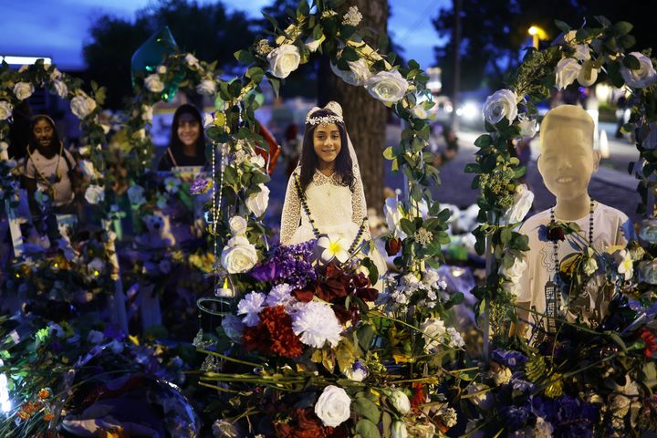 UVALDE, TEXAS - JUNE 02: Flowers and photographs are seen at a memorial dedicated to the victims of the mass shooting at Robb Elementary School on June 2, 2022 in Uvalde, Texas. 19 students and two teachers were killed on May 24 after an 18-year-old gunman opened fire inside the school. Wakes and funerals for the 21 victims are scheduled throughout the week. (Photo by Alex Wong/Getty Images)