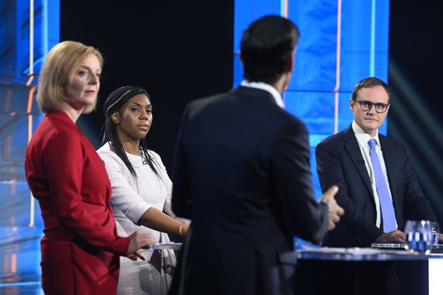 Tom Tugendhat looks on as Rishi Sunak makes a point during last night's ITV debate.