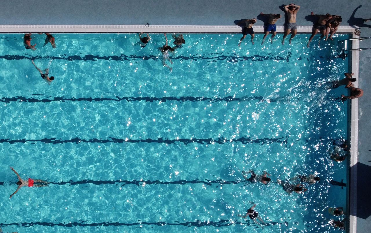 An aerial view shows people swimming in the sun at Hathersage Swimming Pool, west of Sheffield in northern England, on Monday.