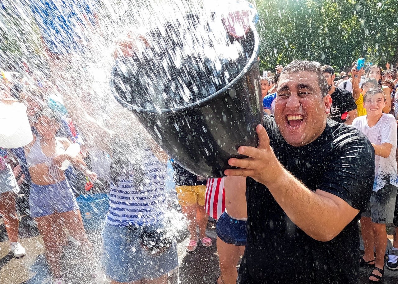 Revellers take part in the annual "Naval Battle" of Vallecas in Madrid on Sunday.