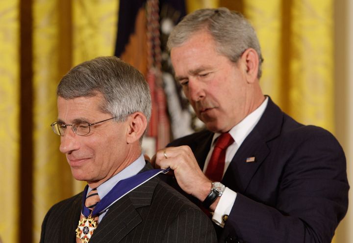 President George W. Bush places the Presidential Medal of Freedom on Dr. Anthony Fauci in 2008. 
