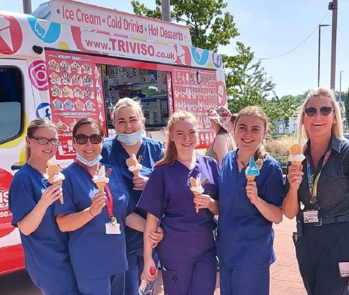 Hospital staff at Alder Hey Children's Charity of hospital staff who were given free ice cream to help them battle the soaring temperatures.