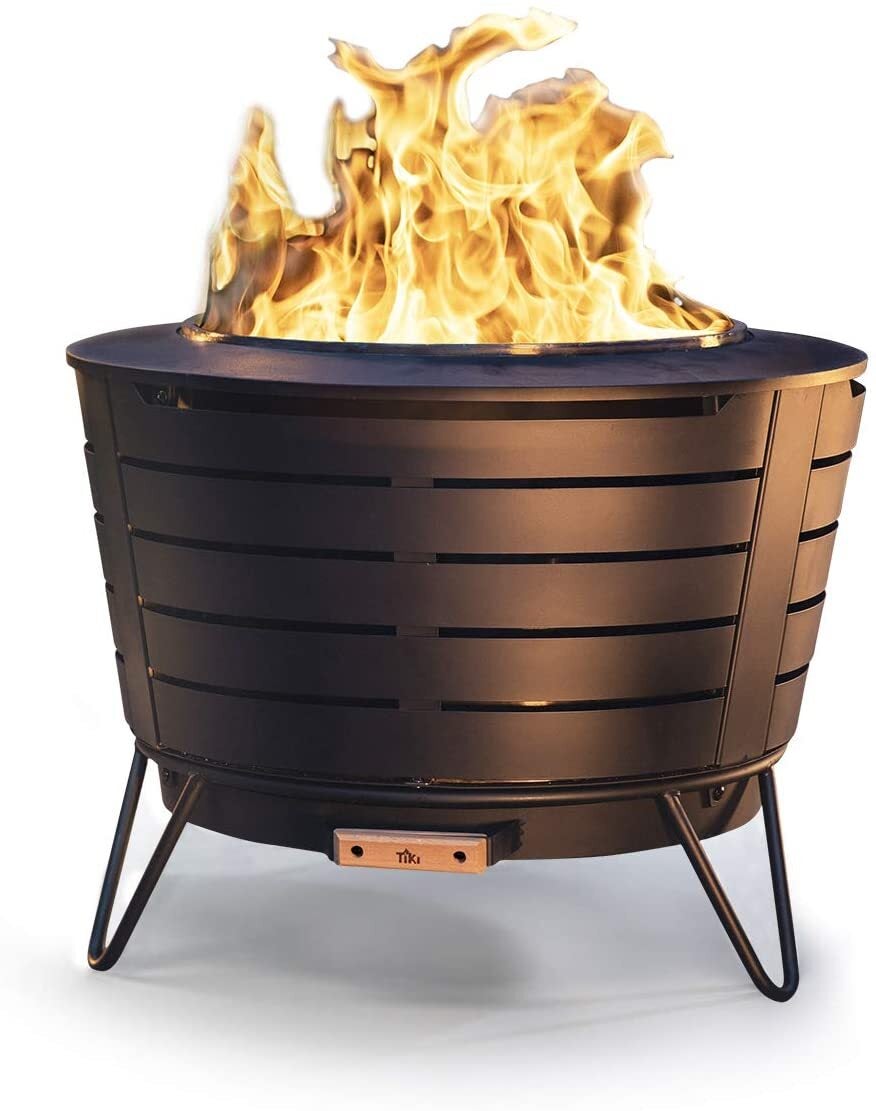 A Tiki brand portable wood-burning fire pit with a removable ash pan