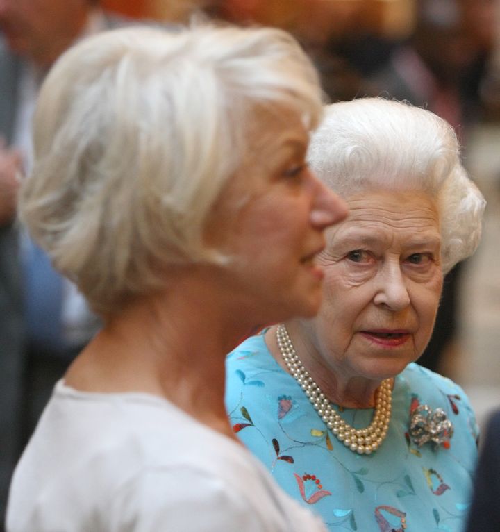 Queen Elizabeth II meets with Dame Helen Mirren (L) at a performing Arts reception at Buckingham Palace on May 9, 2011 in London, England. (Photo by Dominic Lipinski - WPA Pool/Getty Images)