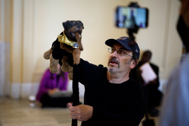 Robert Smigel, one of the people arrested, performs as Triumph the Insult Comic Dog in the Capitol.