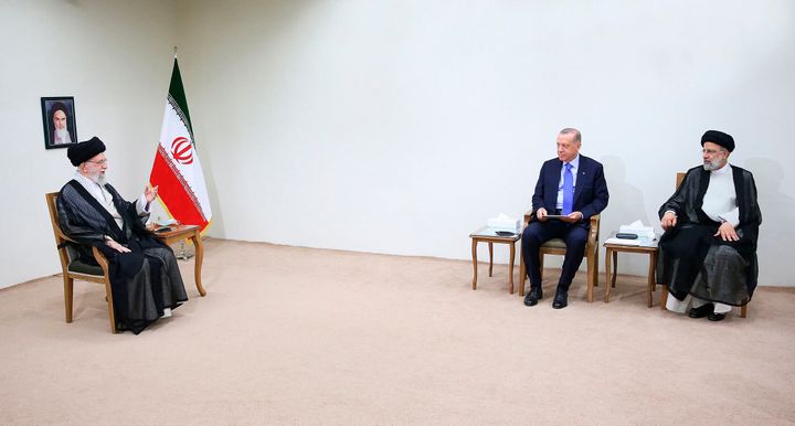 In this picture released by the office of the Iranian supreme leader, Supreme Leader Ayatollah Ali Khamenei, left, speaks during his meeting with Turkish President Recep Tayyip Erdogan, second right, as Iranian President Ebrahim Raisi, sits at right, in Tehran, Iran on July 19, 2022.