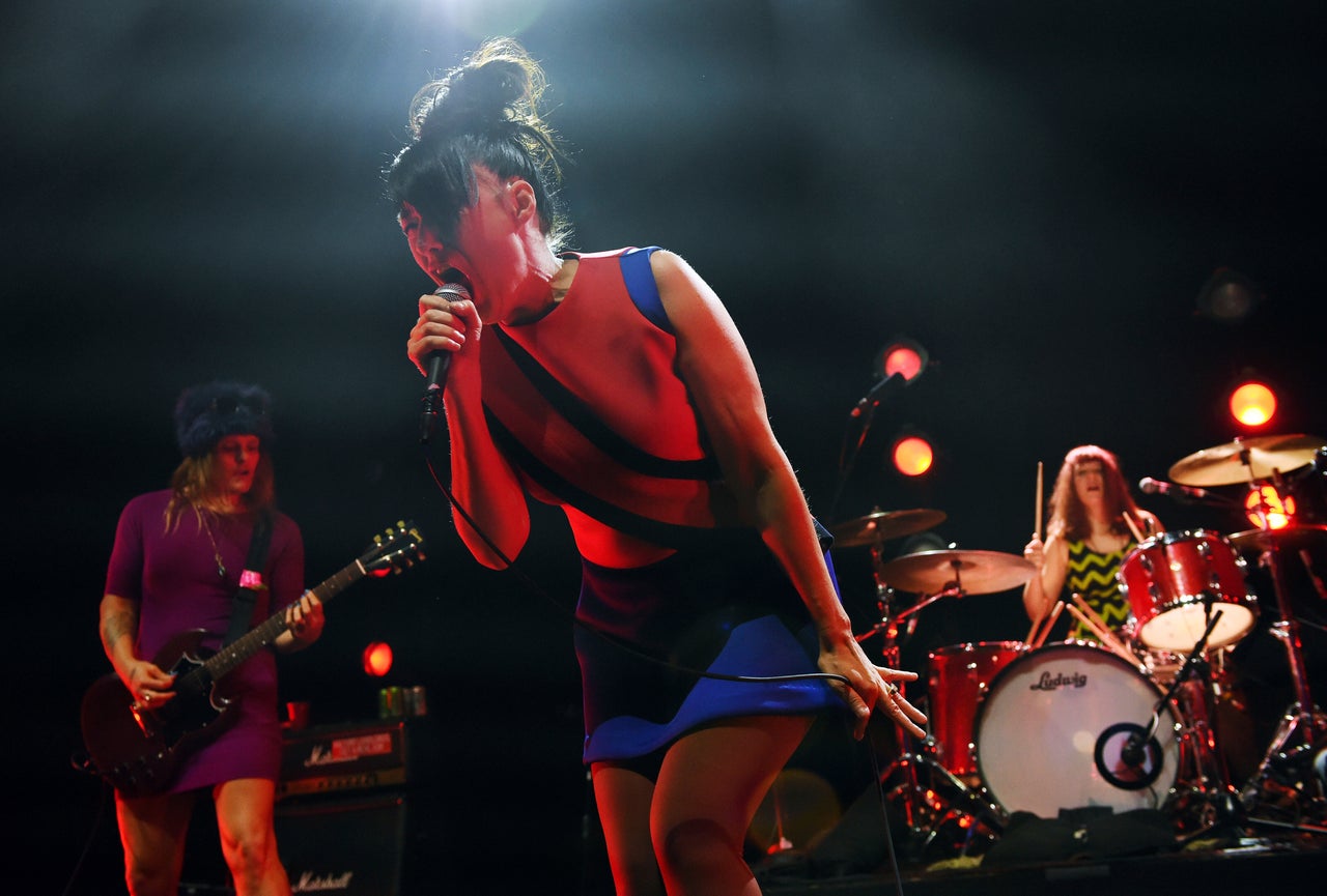 Kathleen Hanna of the punk rock band Bikini Kill performs alongside bandmates Erica Dawn Lyle (left) and Tobi Vail at Los Angeles' Hollywood Palladium in May 2019.