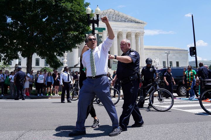 Rep. Andy Levin (D-Mich.) is seen being detained by police outside the U.S. Supreme Court during an abortion rights protest on Tuesday.
