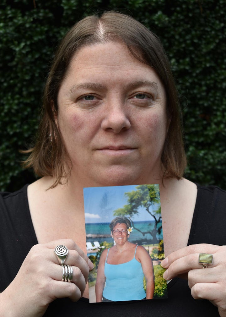 The author with a photo of her sister.