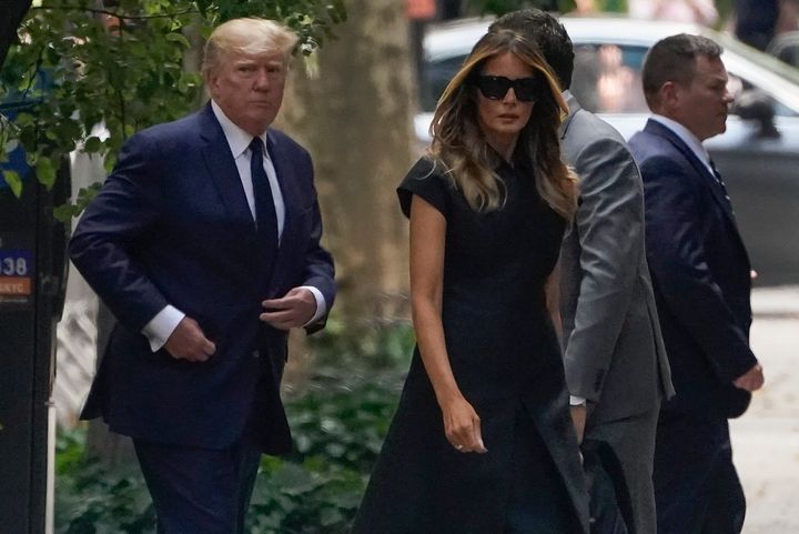 Former President Donald Trump, left, arrives with wife Melania Trump for the funeral of Ivana Trump.