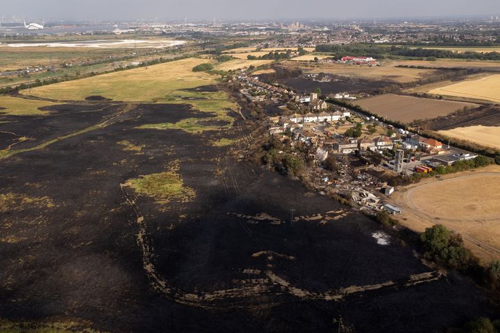 The scene after a blaze in the village of Wennington, east London, after temperatures topped 40C in the UK for the first time ever.