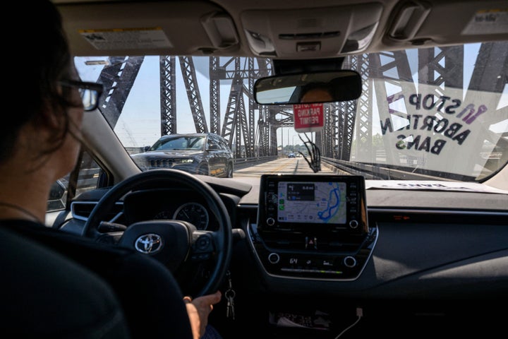 Lori Lamprich, a volunteer driver for Midwest Access Coalition, an abortion fund, drives her car from St. Louis over the Missouri state border to Illinois.