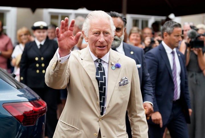 The Prince of Wales waves to members of the public during a visit to Cockington Court on July 20 in Torquay, United Kingdom.