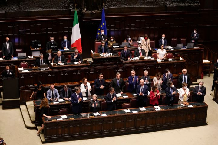 Italian Premier Mario Draghi, background center, delivers his speech at the Parliament in Rome, on July 21, 2022.