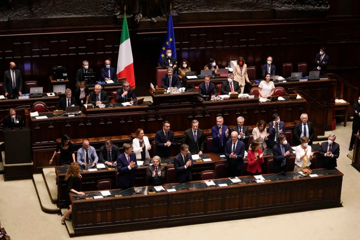 Italian Premier Mario Draghi, background center, delivers his speech at the Parliament in Rome, on July 21, 2022.