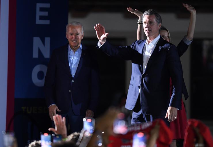 President Joe Biden waves onstage with California Gov. Gavin Newsom and his wife, Jennifer Siebel Newsom, during a campaign event on Sept. 13, 2021 in Long Beach, California.