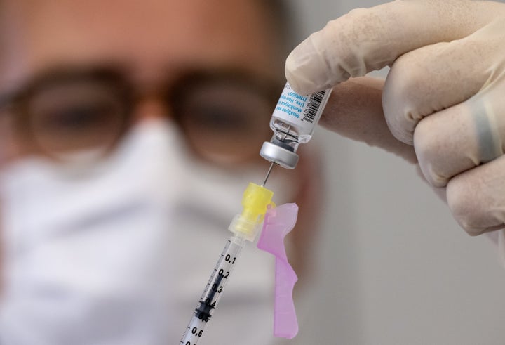 14 July 2022, Bavaria, Munich: An employee prepares a syringe with Bavarian Nordic's vaccine (Imvanex / Jynneos) against monkeypox at Klinikum rechts der Isar. Photo: Sven Hoppe/dpa (Photo by Sven Hoppe/picture alliance via Getty Images)