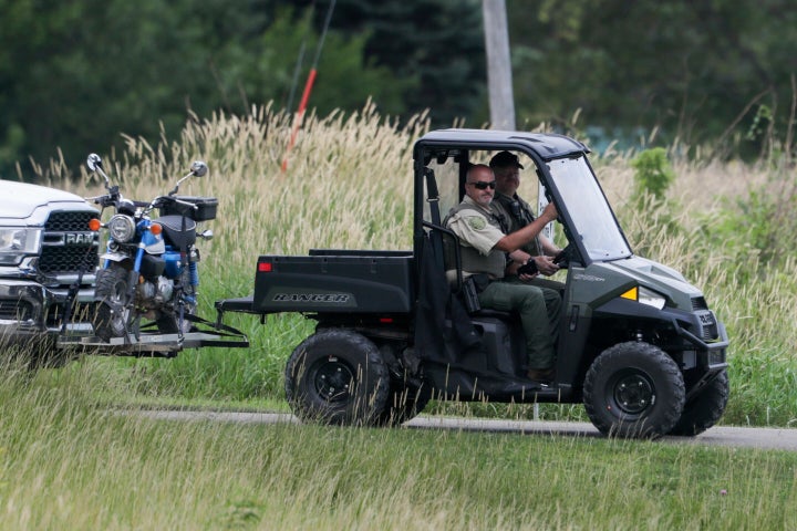 An entrance to the Maquoketa Caves State Park is blocked as police investigate a deadly shooting on Friday, July 22, 2022, in Maquoketa, Iowa.