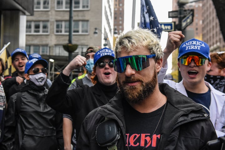 NEW YORK, NY - NOVEMBER 13: Far right livestreamer Baked Alaska (C) is cheered on by people associated with the far-right group America First in front of Pfizer world headquarters on November 13, 2021 in New York City. A U.S. Circuit Court granted an emergency stay to temporarily stop the Biden administration's vaccine requirement for businesses with 100 or more workers as many feel it is an unlawful overreach. (Photo by Stephanie Keith/Getty Images)