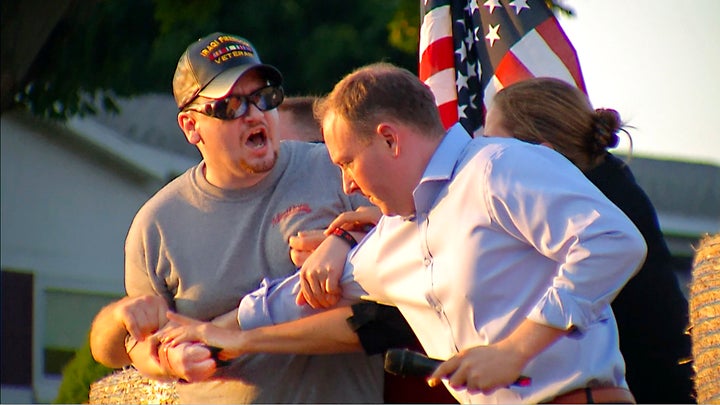 David Jakubonis, left, is subdued as he brandishes a sharp object during an attack against Rep. Lee Zeldin, as the Republican candidate for New York governor delivered a speech in Perinton, N.Y., on Thursday.