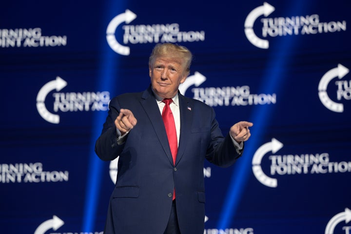Former President Donald Trump reacts before addressing attendees during the Turning Point USA Student Action Summit, Saturday, July 23, 2022, in Tampa, Fla. (AP Photo/Phelan M. Ebenhack)