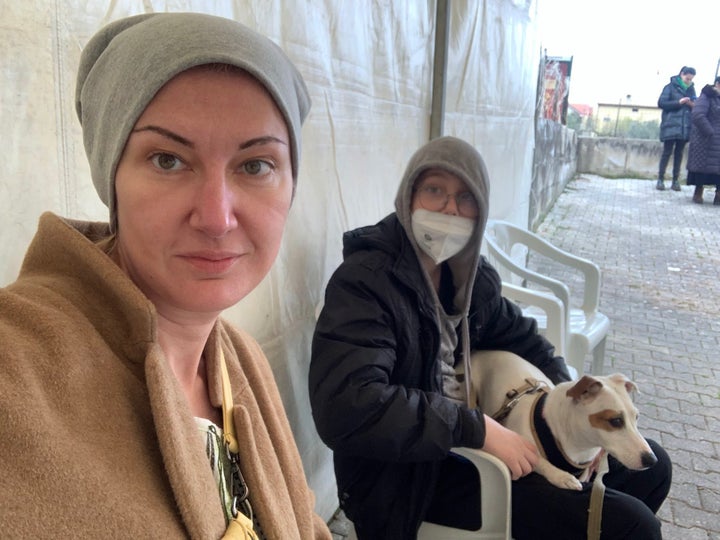 The author with her younger son and their dog on the first day in the Italian town they're calling home, which they reached after four days of travel.