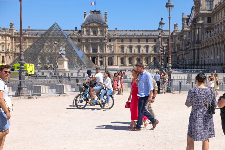 Jennifer Lopez and Ben Affleck are seen strolling near the Louvre Museum.