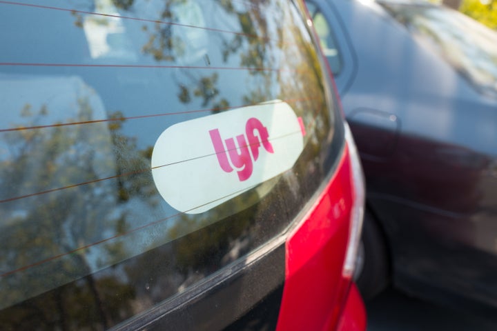Sticker for Lyft on the back of a car.