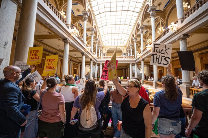 Anti-abortion and abortion rights activists protest on multiple floors of the Indiana State Capitol rotunda on Monday. 