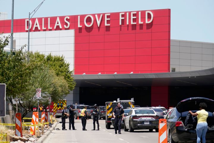 Emergency responders converge near the main entrance at Dallas Love Field in Dallas, on Monday, July 25, 2022. (AP Photo/Tony Gutierrez)