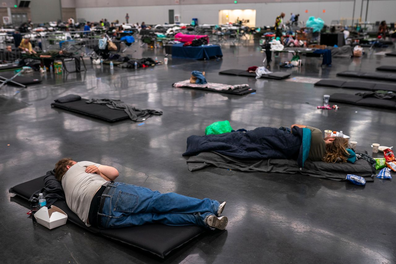 Portland residents fill a cooling center that has a capacity of about 300 people at the Oregon Convention Center on June 27, 2021. 