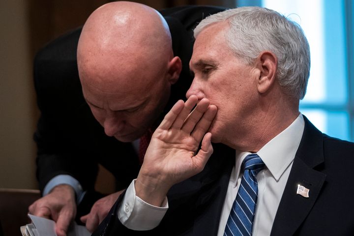 Former Vice President Mike Pence and his chief of staff Marc Short confer during a meeting on March 2, 2020, in Washington.