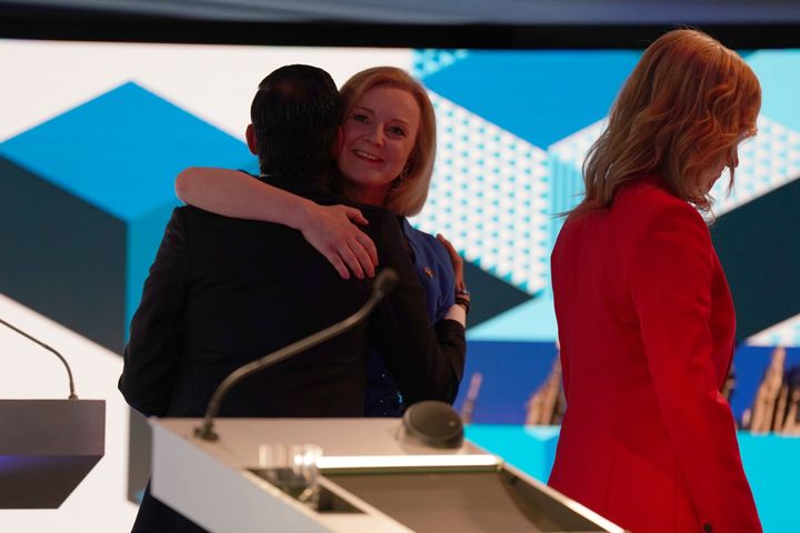 Rishi Sunak and Liz Truss hug each other after taking part in the BBC Leadership debate presented by Sophie Raworth.