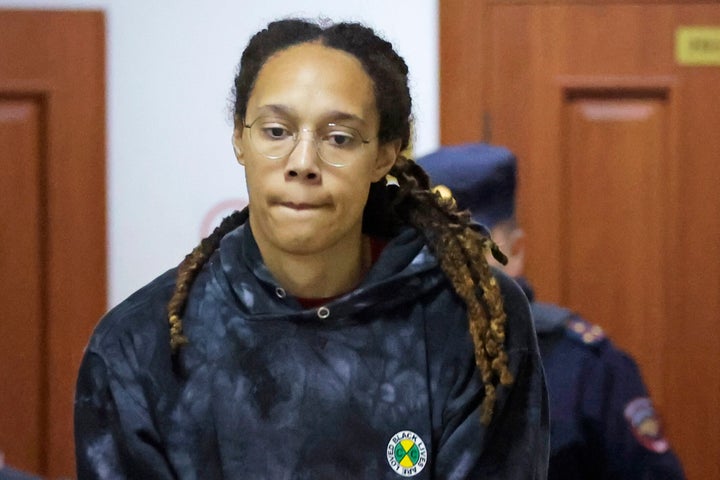 WNBA star and two-time Olympic gold medalist Brittney Griner is escorted to a courtroom for a hearing, in Khimki just outside Moscow, Russia, Monday, July 25, 2022.