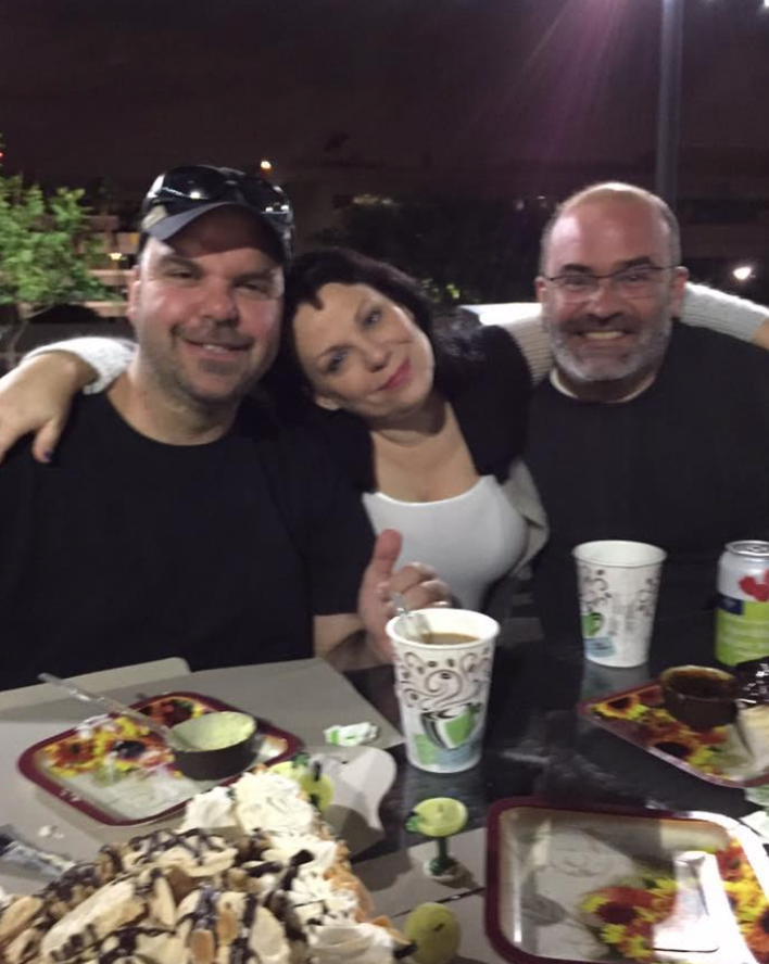 The author, "Mair Smyth" and the author's husband, Pablo, hanging out in the barbecue area of their apartment complex in 2015.