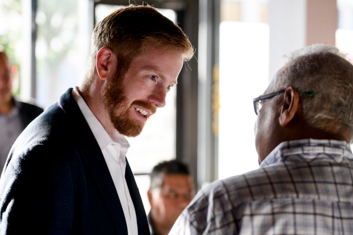 U.S. Rep. Peter Meijer (R-Mich.) speaks with potential voters before an event for the West Michigan Hispanic Chamber of Commerce in Grand Rapids on Monday.