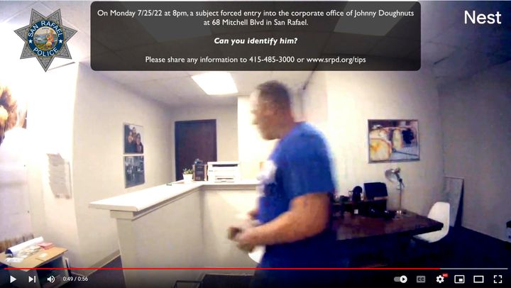 This Monday, July 25, 2022, image taken from a surveillance video posted on YouTube and provided by the San Rafael Police Department shows a subject who forced entry into the corporate office of Johnny Doughnuts in San Rafael. The burglar had to double back to the scene of the crime, the corporate office of a the San Francisco Bay Area doughnut company – this week because he forgot his keys. Police are asking for the public's help in identification. (San Rafael Police Department via AP)