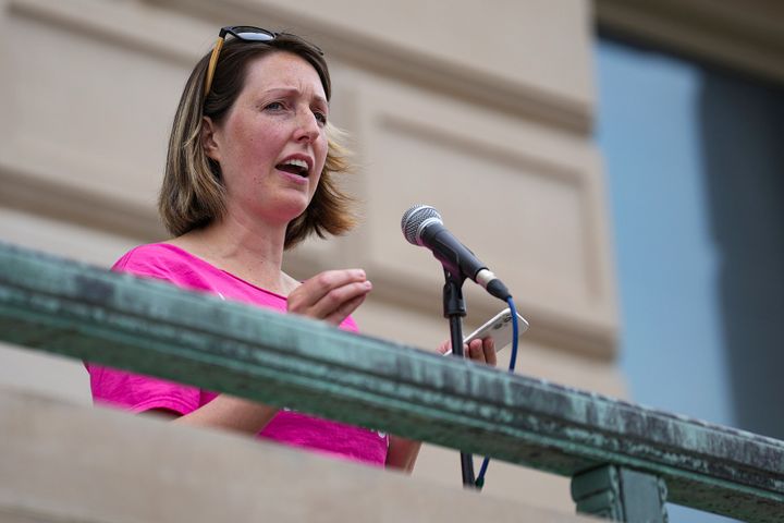 Dr. Caitlin Bernard speaks at an abortion rights rally on June 25 at the Indiana Statehouse in Indianapolis. The lawyer for Bernard, who drew criticism after speaking out about a 10-year-old girl who traveled from Ohio for an abortion, said her client provided proper treatment and did not violate privacy laws in discussing the unidentified girl's case.