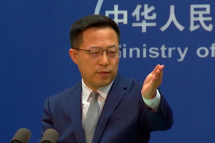 In this image made from video, Chinese Foreign Ministry spokesperson Zhao Lijian gestures during a media briefing at the Ministry of Foreign Affairs office, on Wednesday, April 6, 2022, in Beijing.