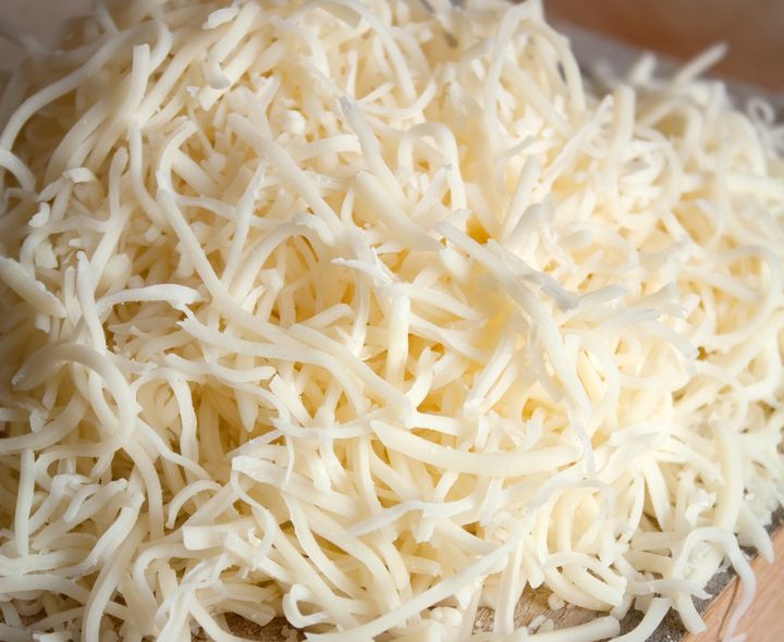 Shredded mozzarella cheese is commonly used on pizza.