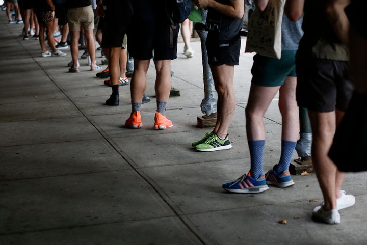 People wait in line to recieve the monkeypox vaccine on July 17 before the opening of a new mass vaccination site at the Bushwick Education Campus in New York City.