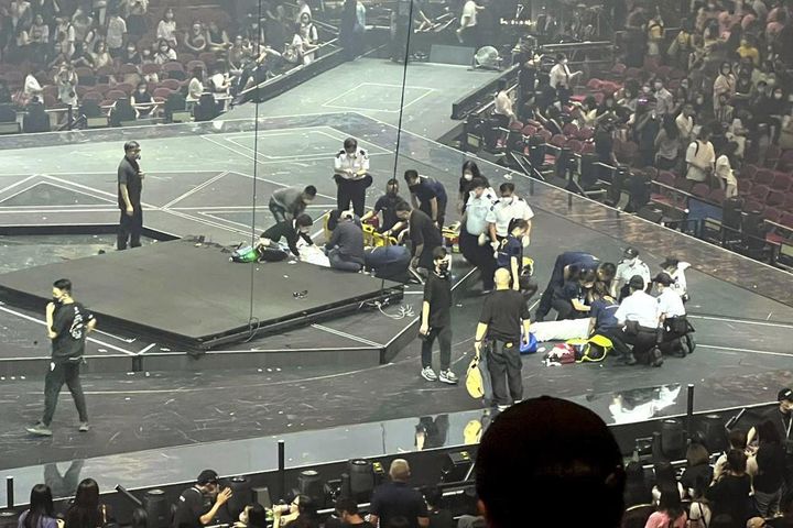 Two dancers receive medical treatment at the concert. Hong Kong officials say they will open an investigation into the concert accident. 