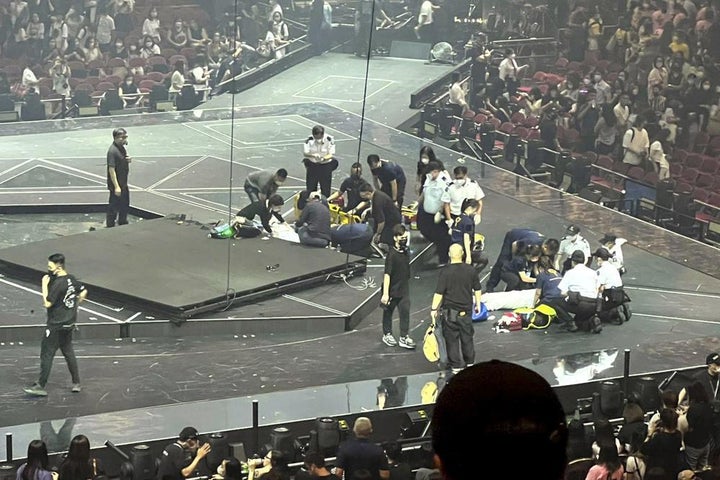Two dancers receive medical treatment at the concert. Hong Kong officials say they will open an investigation into the concert accident.