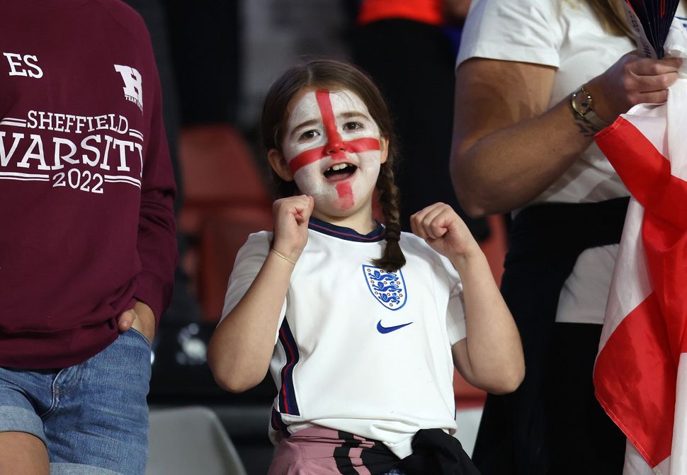 A young England fan cheers on the Lionesses during the England-Sweden game.
