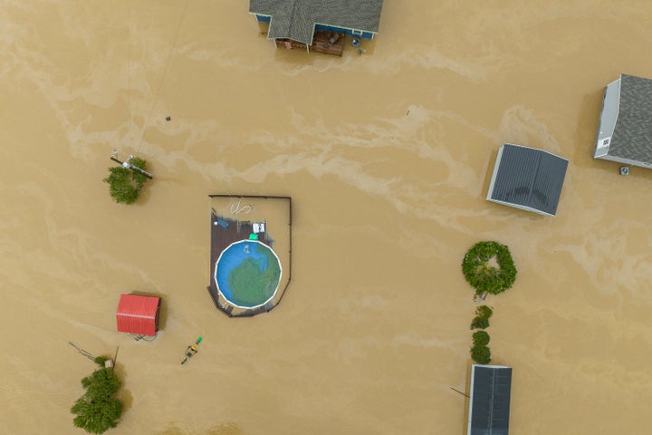 Home and structures are flooded near Quicksand, Kentucky, on July 28.