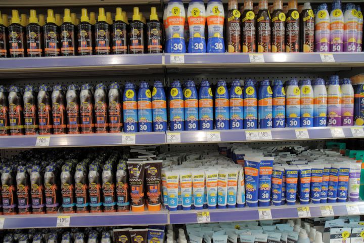 Banana Boat products line the shelves of a Walgreens pharmacy in Miami Beach, Florida, in this file photo. Some lots of Banana Boat Hair & Scalp Sunscreen Spray SPF 30 have been recalled by the manufacturer.