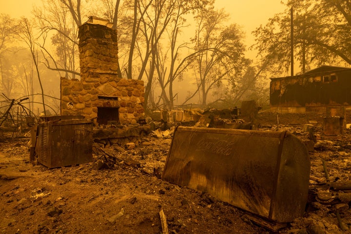 An old Coca-Cola refrigerator lies in the ruins of a property in the community of Klamath River, which burned in the McKinney Fire in Klamath National Forest, northwest of Yreka, California, on July 31, 2022.