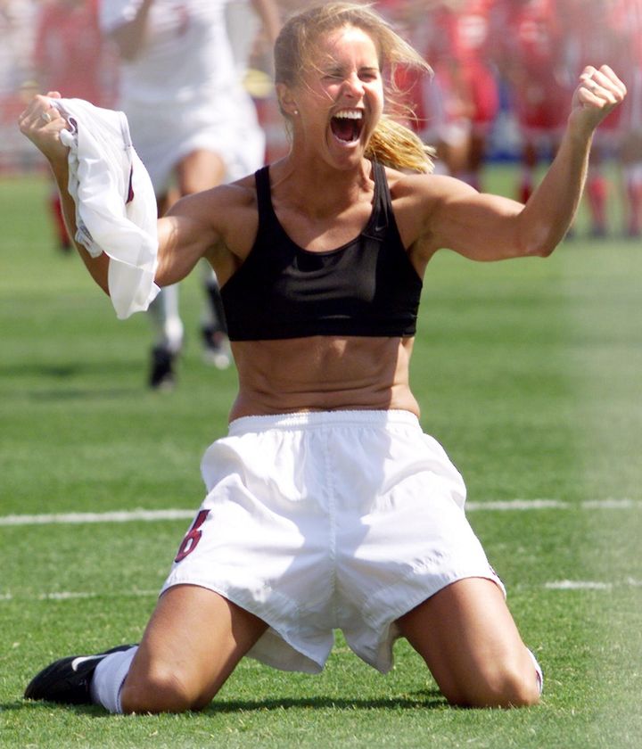 Brandi Chastain of the U.S. shouts after falling on her knees after she scored the last goal in a shoot-out in the finals of the Women's World Cup with China at the Rose Bowl in Pasadena, California, on July 10, 1999.